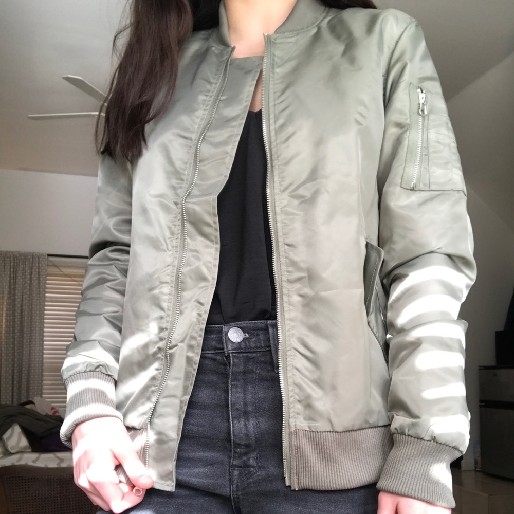 Olive green bomber jacket with orange interior